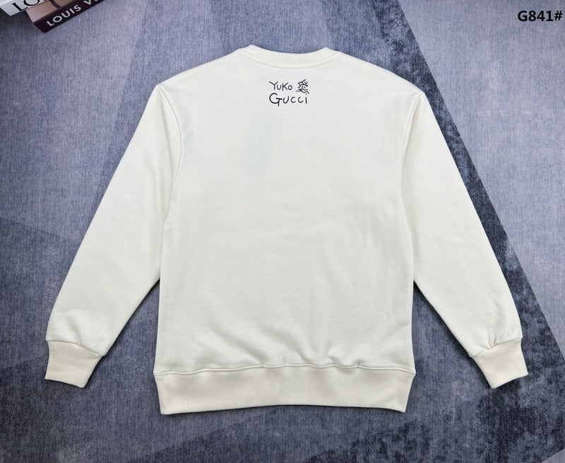 Side profile of Gucci luxury clothing with signature branding