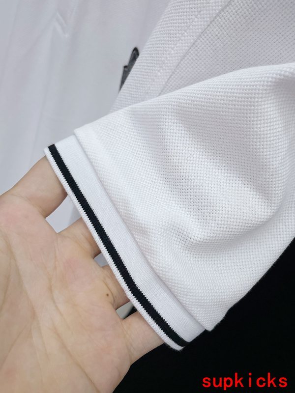 Flat lay presentation of Moncler luxury clothing with logo-detail design