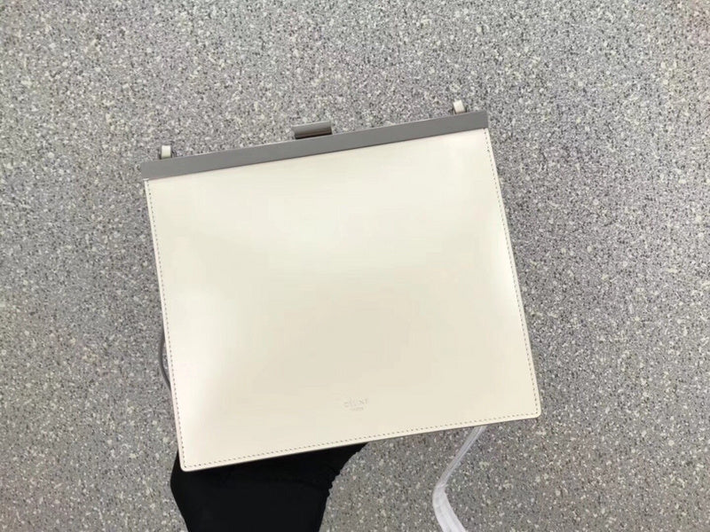 Side profile of statement polished women's handbag – women's statement bag