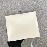 Side profile of statement polished women's handbag – women's statement bag