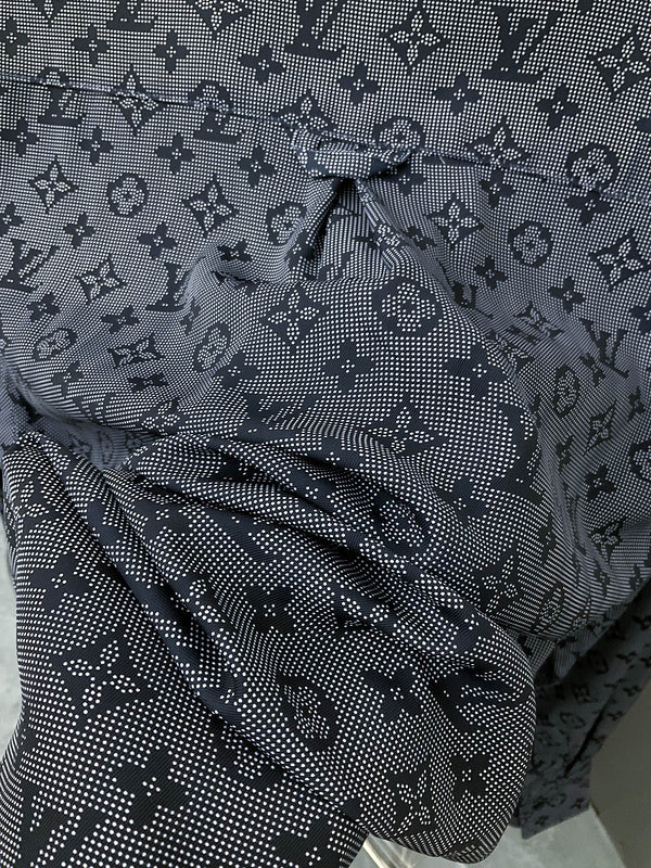Front view of Louis Vuitton luxury clothing with label-forward styling