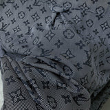 Front view of Louis Vuitton luxury clothing with label-forward styling