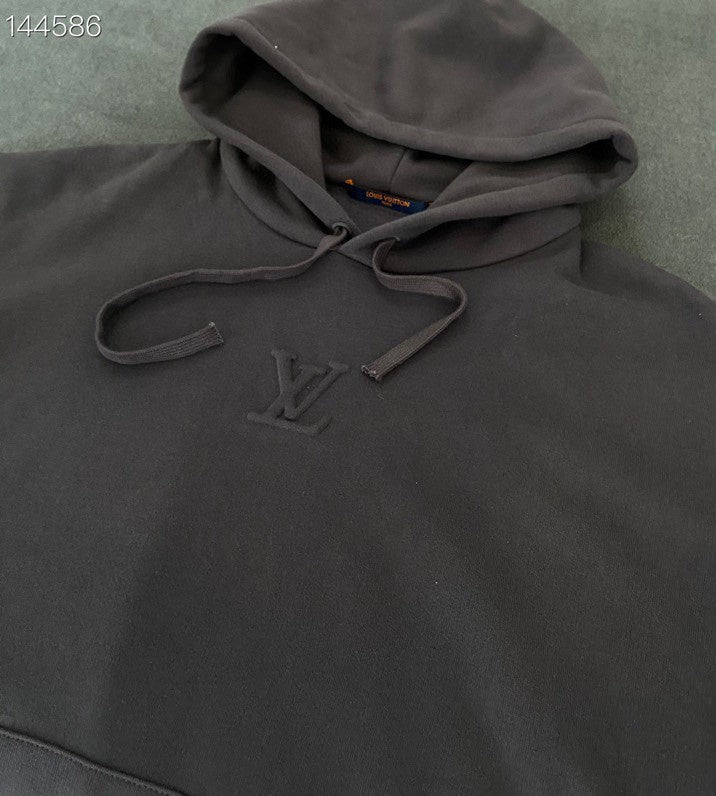 Front view of Louis Vuitton luxury clothing with everyday silhouette