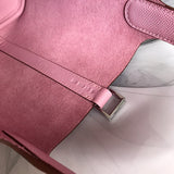 Side view of timeless structured handbag