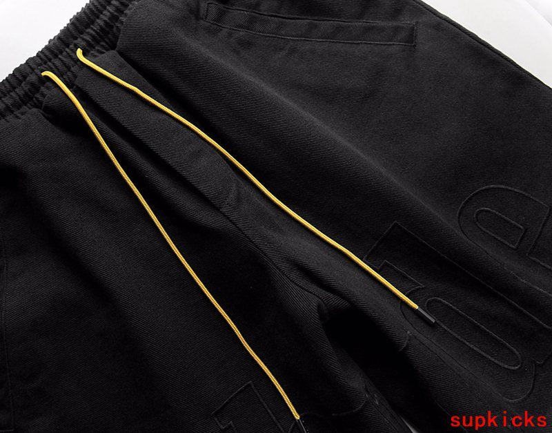 Flat lay presentation of Rhude luxury clothing with everyday silhouette