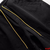Flat lay presentation of Rhude luxury clothing with everyday silhouette