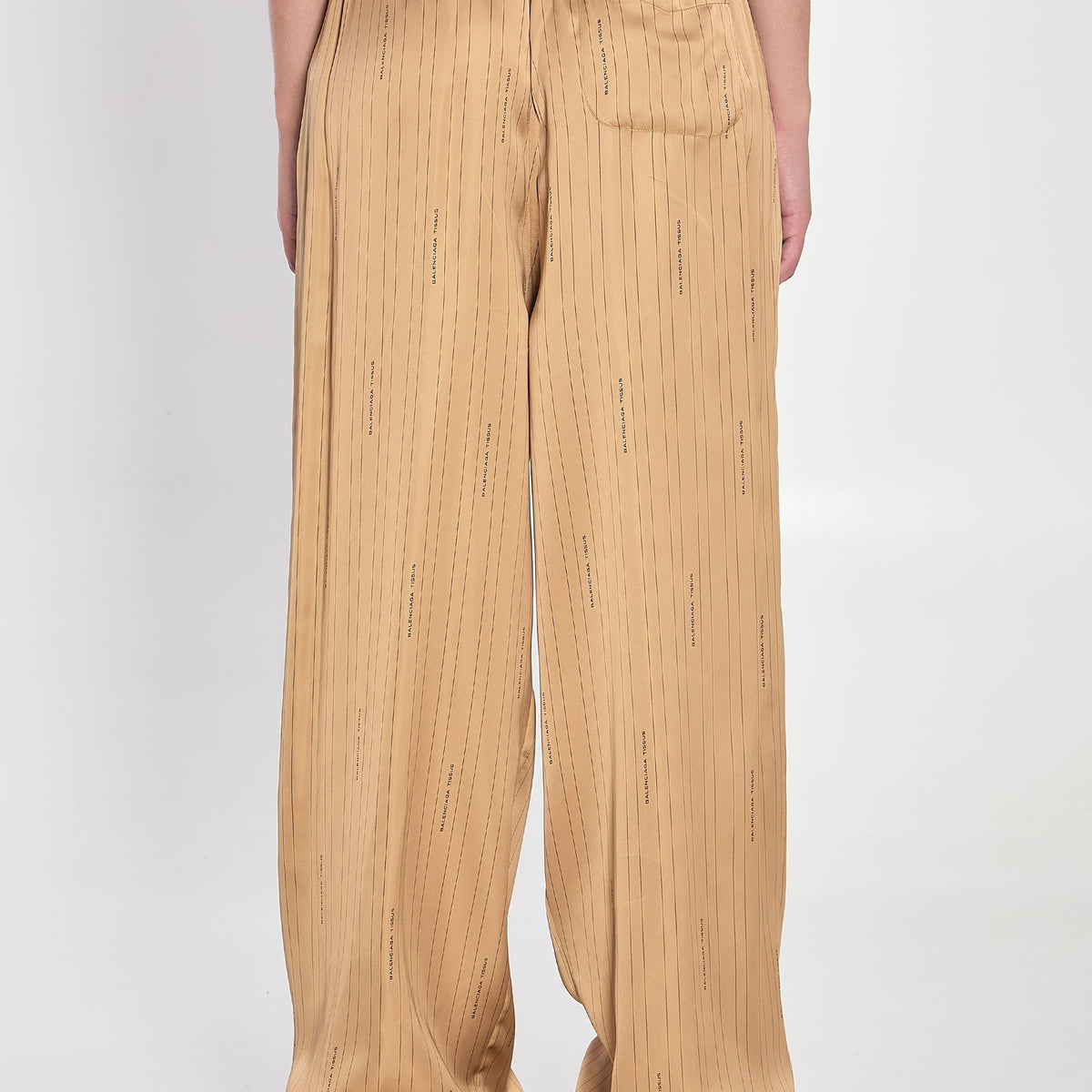 Close-up of Balenciaga pants hardware and fine stitching