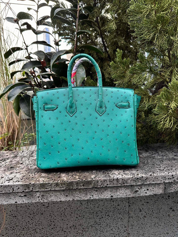 Side view of streamlined structured handbag