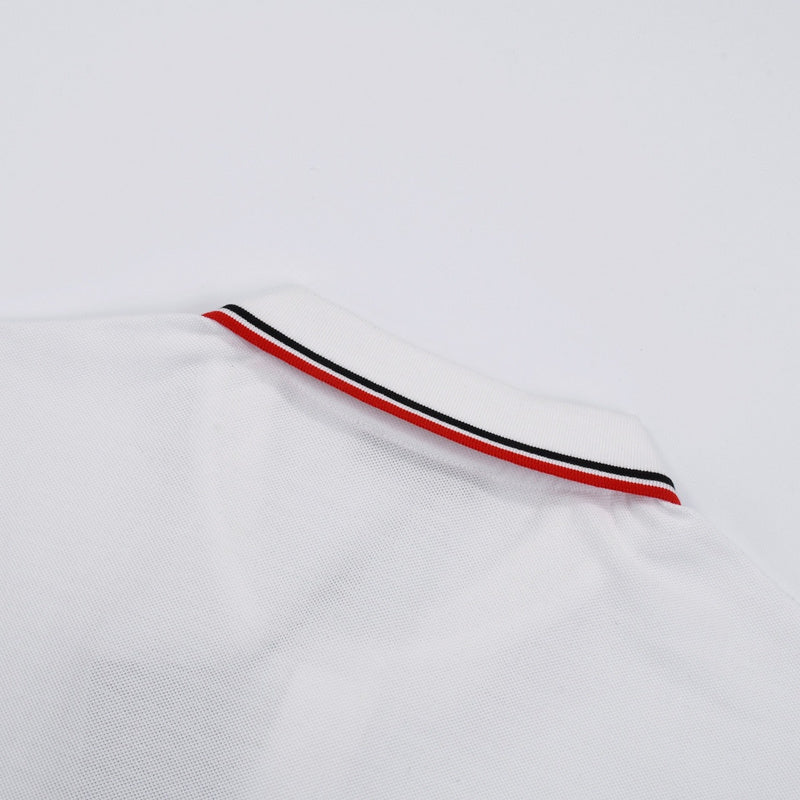 Close-up detail shot of Polo cotton polo shirt with signature branding