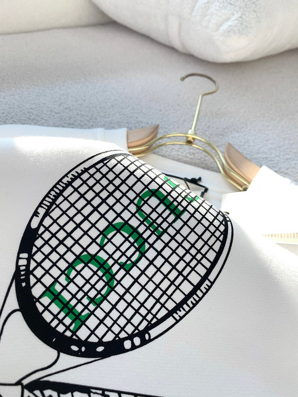 Close-up detail shot of Gucci luxury clothing with monogram-inspired silhouette