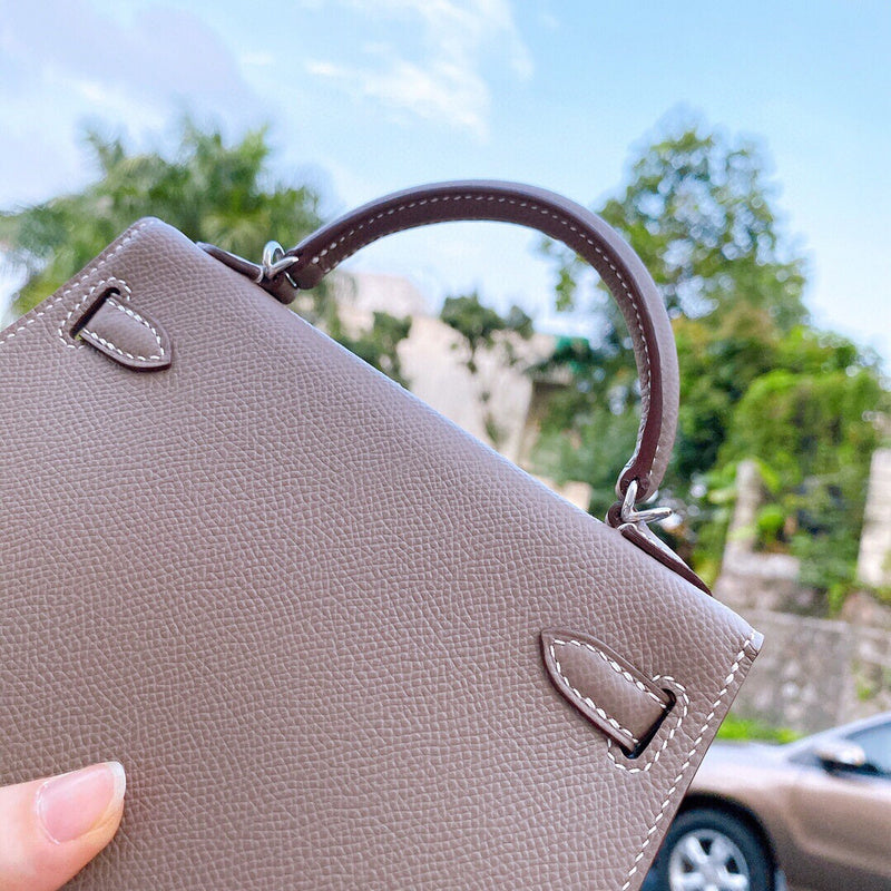 Side view of graceful structured handbag