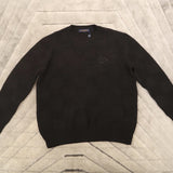 Side profile of Louis Vuitton luxury clothing with logo-detail design