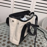 Styled lifestyle shot of structured everyday-luxe women's handbag – women's everyday handbag