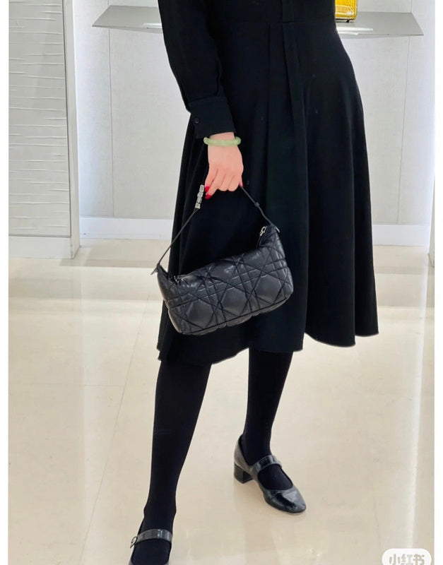 Styled lifestyle shot of polished classic women's handbag – women's premium purse