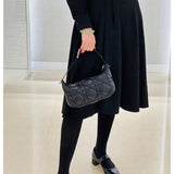 Styled lifestyle shot of polished classic women's handbag – women's premium purse