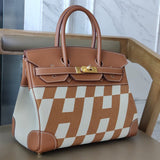 Side view of understated structured handbag