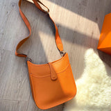 Side view of minimalist structured handbag