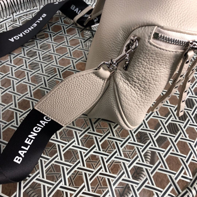 Styled lifestyle shot of everyday-luxe signature women's handbag – women's luxury accessory