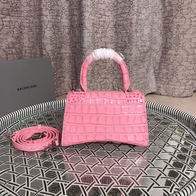Styled lifestyle shot of structured classic women's handbag – women's luxury handbag