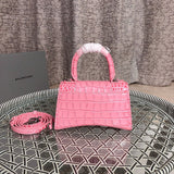 Styled lifestyle shot of structured classic women's handbag – women's luxury handbag