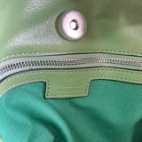 Side profile of polished structured women's handbag – women's designer-style accessory