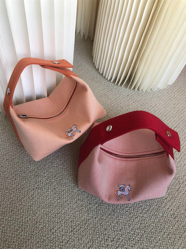  Sleek top-handle bag carried on shoulder