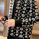 Close-up detail shot of Louis Vuitton luxury clothing with runway-inspired design