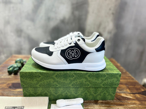 Gucci Designer sneakers in fresh white-and-black signature lace-up style front view