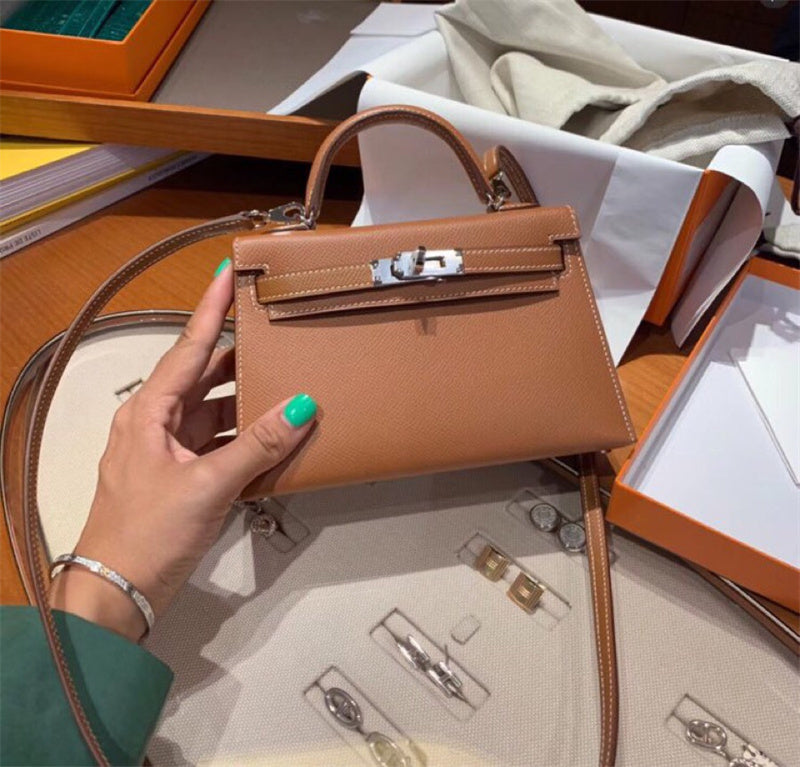  Signature crossbody bag carried on shoulder 16