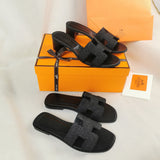 Hermes sandals Style 021 - close-up of statement logo accent