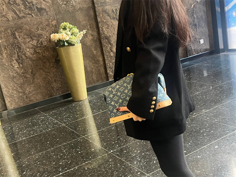  Understated crossbody bag carried on shoulder 22