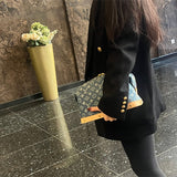  Understated crossbody bag carried on shoulder 22