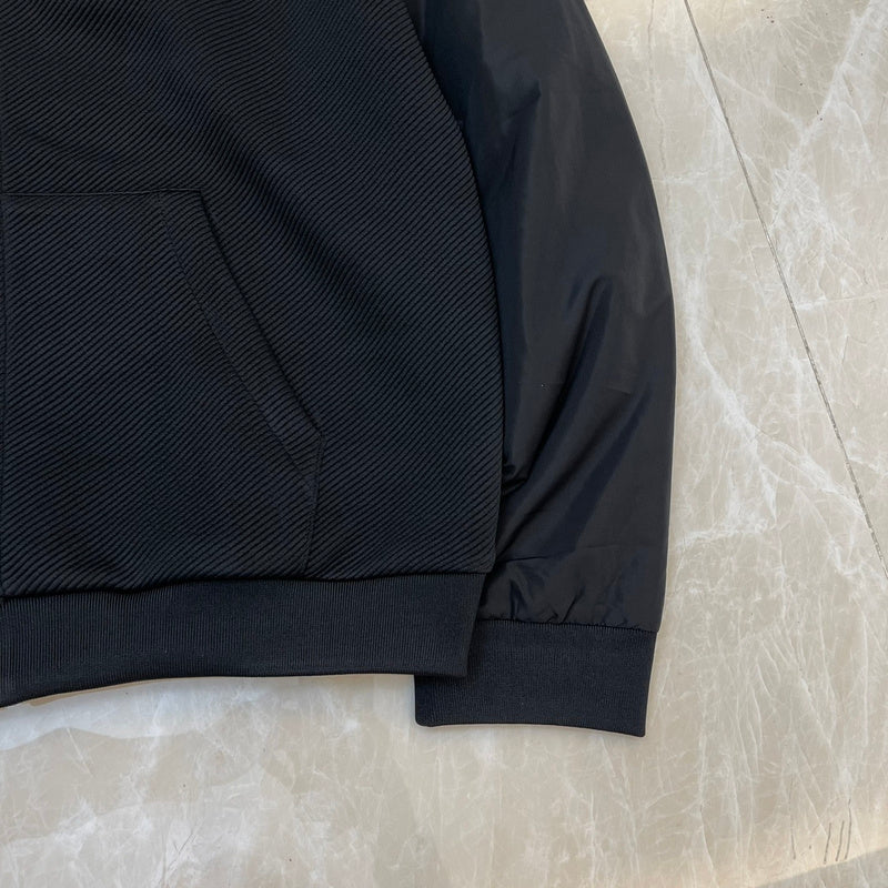 Side profile of Louis Vuitton luxury clothing with label-forward styling