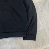 Side profile of Louis Vuitton luxury clothing with label-forward styling