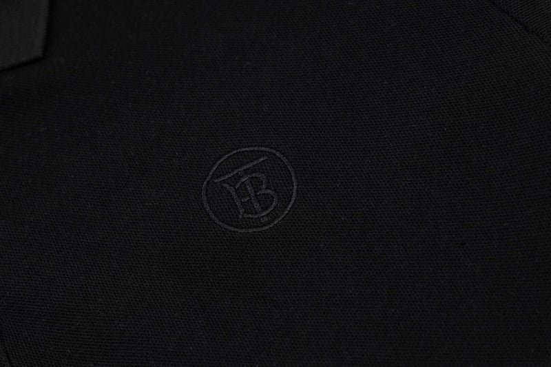 Flat lay presentation of Polo cotton polo shirt with monogram-inspired silhouette