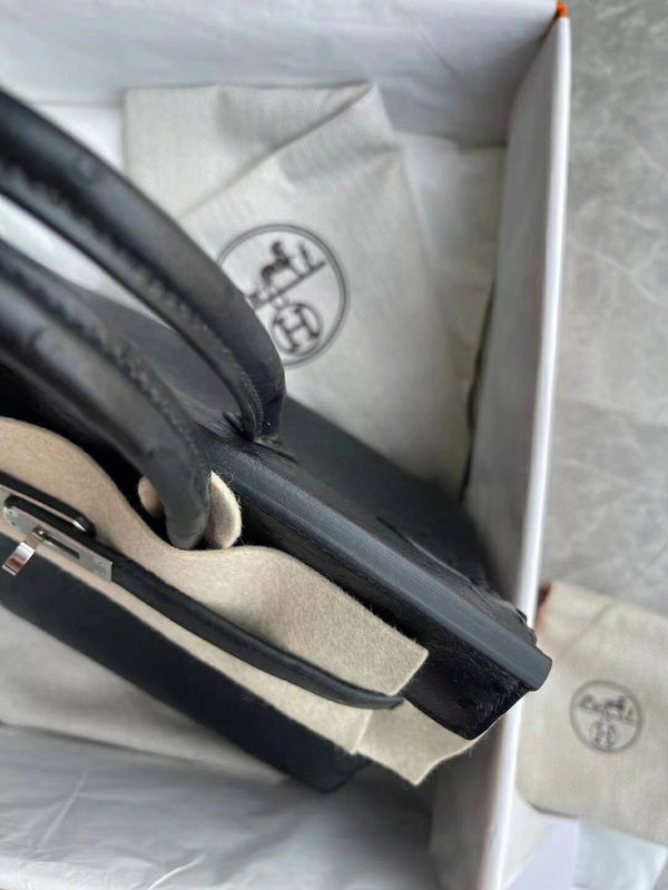 Side view of streamlined structured handbag