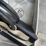 Side view of streamlined structured handbag