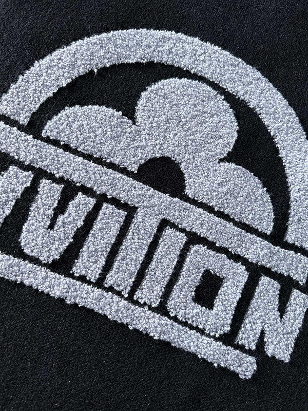 Flat lay presentation of Louis Vuitton luxury clothing with logo-detail design