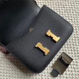 Side view of poised structured handbag