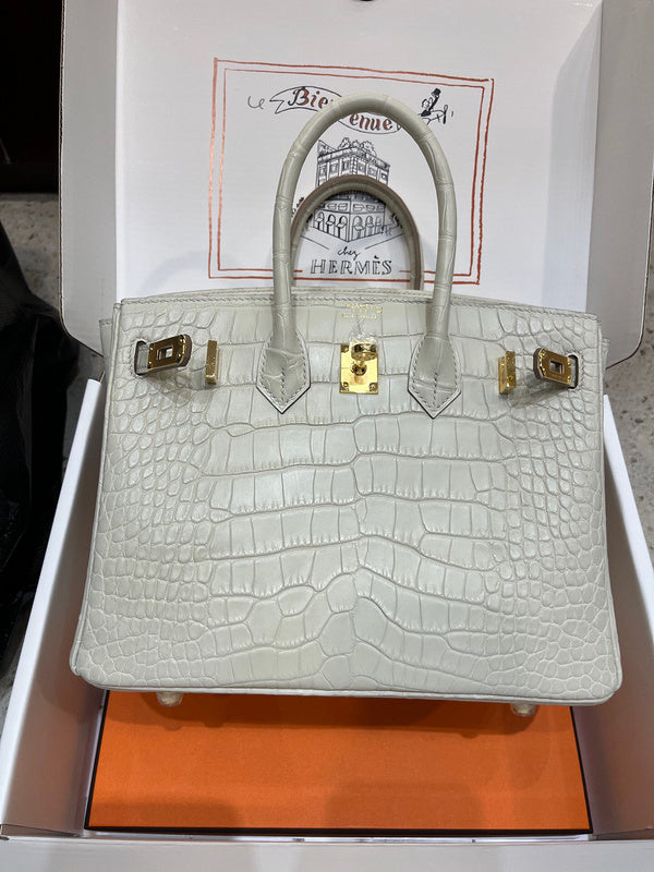 Side view of understated structured handbag