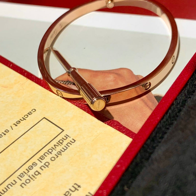 Side view of Cartier unisex jewelry piece