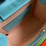 Styled lifestyle shot of signature classic women's handbag – women's designer-style accessory