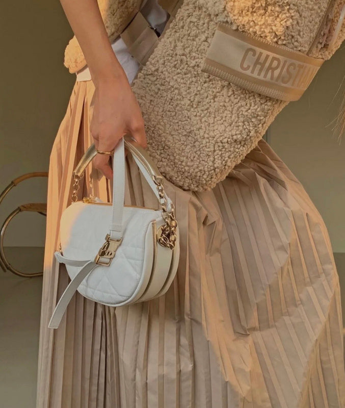 Styled lifestyle shot of structured premium women's handbag – women's luxury handbag