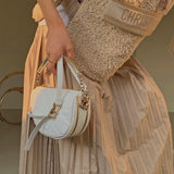 Styled lifestyle shot of structured premium women's handbag – women's luxury handbag