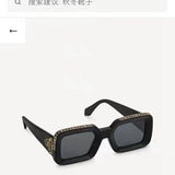 Close-up detail view of Louis Vuitton unisex sunglasses