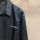 Close-up detail shot of Louis Vuitton luxury clothing with everyday silhouette