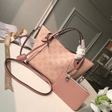 Handle and strap detail of elevated signature women's handbag – women's statement bag