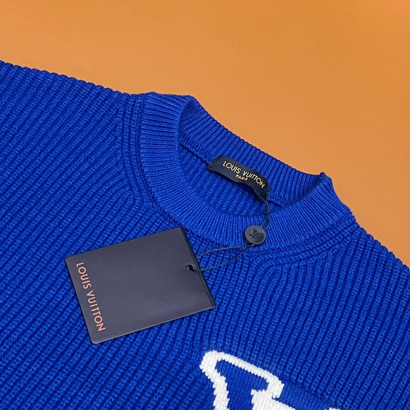 Close-up detail shot of Louis Vuitton luxury clothing with monogram-inspired silhouette