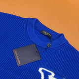 Close-up detail shot of Louis Vuitton luxury clothing with monogram-inspired silhouette