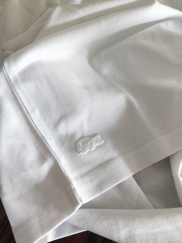 Side profile of Lacoste luxury clothing with tailored silhouette